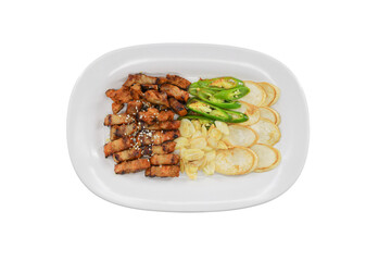 Sizzling Culinary Delight: A culinary masterpiece, meticulously arranged on a pristine white platter, beckons with its appetizing arrangement. A delectable symphony of seasoned pork, crisp potatoes.