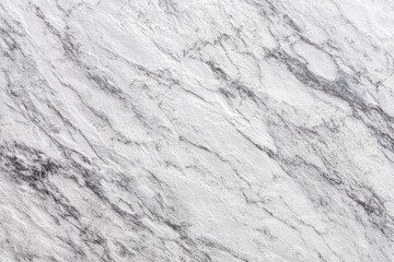 Obraz premium Close-up view of a light gray and white stone surface with flowing, textured patterns