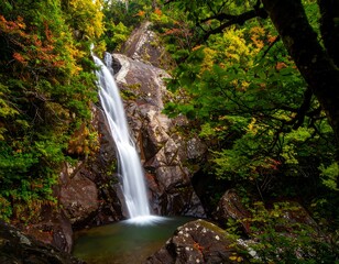 Autumn waterfall cascading into a rock pool