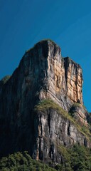 Fototapeta premium Rocky mountain peak against a vibrant blue sky