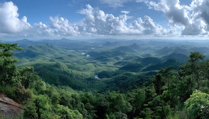 Panoramic mountain vista. Lush green valleys, distant peaks, a clear sky