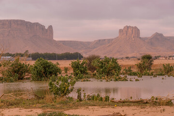 Arabian Peninsula in Saudi Arabia unveils vast desert plains and rugged mountains, with rocky...