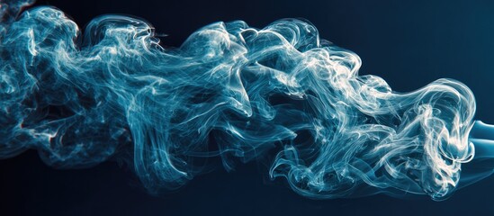 Abstract blue smoke swirls on dark background