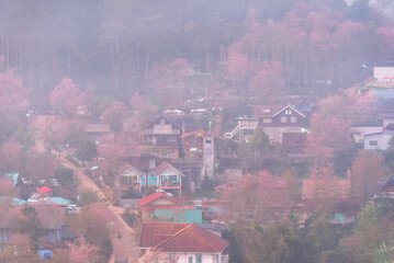 Aerial view from above of white puffy clouds Flying through the clouds above mountain tops.