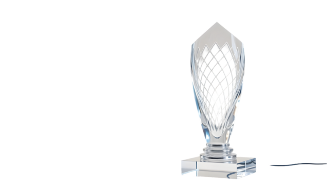 Close up of a clear crystal trophy with a diamond pattern on a black background in a studio shot