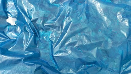 Rainwater on Blue Crumpled Polythene Sheets - Powered by Adobe