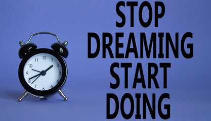 Stop Dreaming Start Doing symbol. Beautiful purple background with alarm clock. Business and Stop...