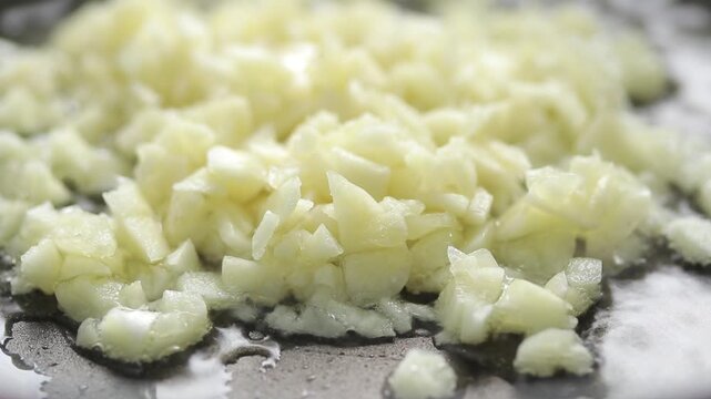 Pan-fried Minced garlic in hot oil. close-up shot