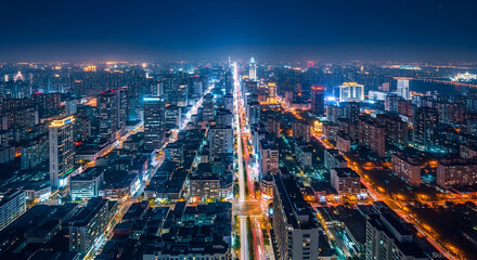Experience the pulsating energy of a modern city at night. This stunning aerial view captures the vibrant lights and dynamic energy, perfect for projects needing a sophisticated touch.