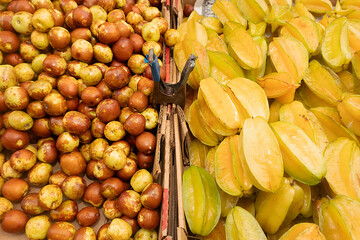 Star fruit and grapes at the market for sale 