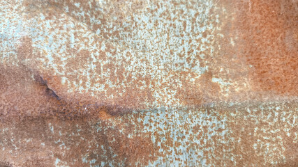 Rusted corrugated zinc wall showcasing vintage decay and weathered textures. Ideal for backgrounds,...