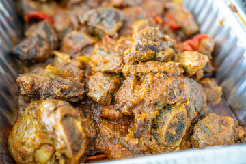 pieces of stewed beef in a tray for a party