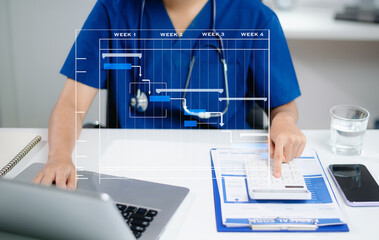 Doctor or nurse calculating and planning healthcare project using Gantt chart, laptop, and data tools. Real people in clinical office