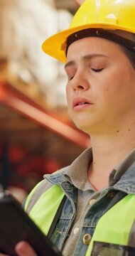 Tablet, headache and woman in warehouse for shipping, order backlog or pain. Logistics, tired or engineer with migraine for stress, overwork or stock loss with mistake on technology for supply chain