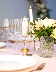 Elegant table setting with candles and flowers