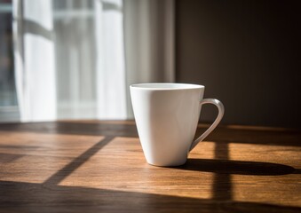 Fototapeta premium Empty white mug on a wooden table by a window.