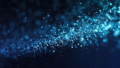 Abstract swirling blue sparkles on dark background