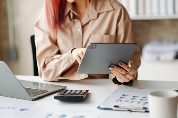 Hand man doing finances and calculate on desk about cost at office.