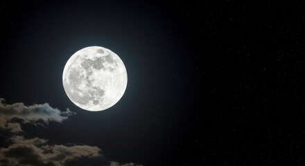 Fototapeta premium A full moon shines brightly in the dark night sky illuminating the stars and clouds