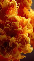 Fototapeta premium Abstract close-up of vibrant orange-yellow ink swirling in liquid