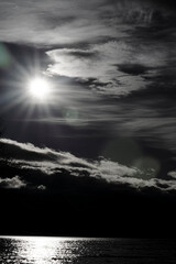 dark moody vertical landscape over water Black and white 