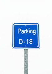 Blue Parking Sign with White Text Showing Parking D 18 on Metal Pole Isolated on White