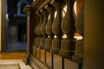19th century vintage wooden balusters and stair railings made of dark wood. High quality photo