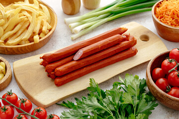 smoked sausages and french fries with fresh onions