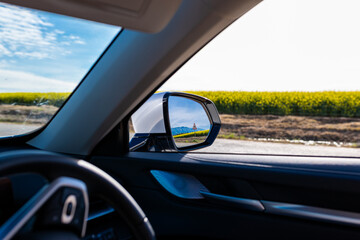 Obraz premium Farm Road adventures in Canola Fields