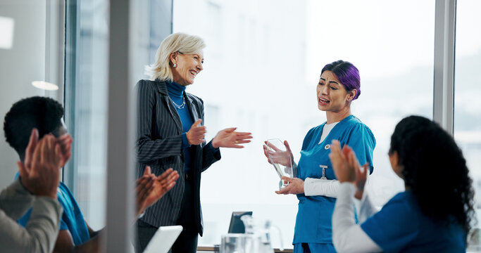 Happy people, medical team and applause with award in meeting for congratulations or achievement. Group, employees or healthcare workers clapping with nurse, reward or trophy for work nomination