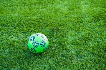 Football equipment ball on grass turf match game background