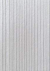 Close-up view of vertical ribbed white surface