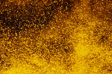 Abstract background with chaotic golden particle flow merging streams big bang universe creation chaos noble metal sandstorm futuristic banner for business presentations ads promotions technology