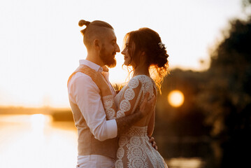 bride girl and groom near the river
