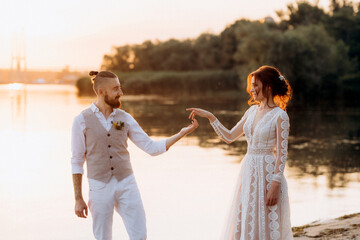 bride girl and groom near the river