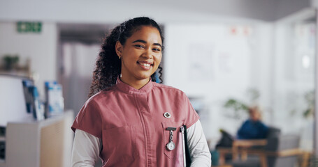 Woman, nurse and happy in hospital for portrait, confidence and community service. Healthcare,...