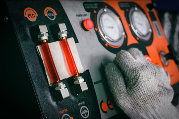 Automatic transmission fluid (ATF) flushing service in garage shop.