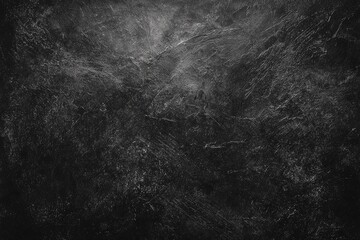 Textured dark gray surface with subtle light highlights