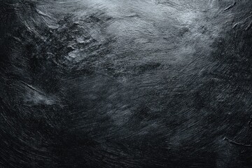 Dark, textured surface with subtle variations in gray-blue tones