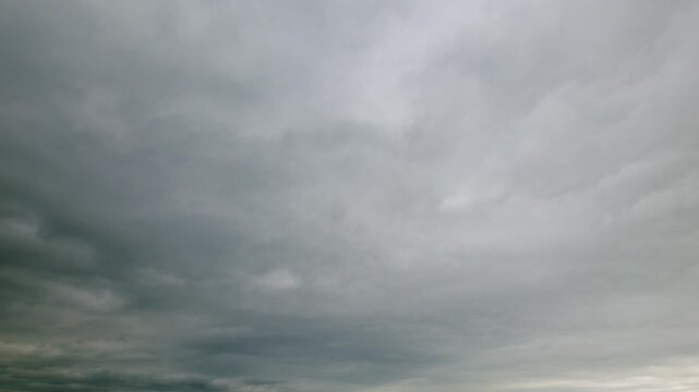 An overcast sky with swirling clouds that evoke feelings of drama and tranquility