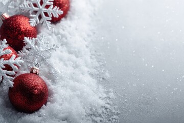 Festive Christmas border with red ornaments and snow