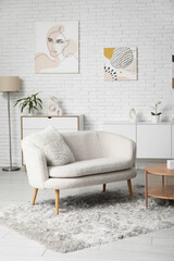Stylish interior of modern living room with white sofa and coffee table