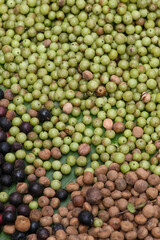 A macro texture of fresh, green mung beans, peas, and other raw organic vegetables makes a healthy, natural food background