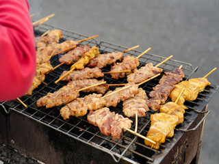 Fresh pork skewered on a charcoal. Thailand traditionally food, Thailand street food, pork are grill with sweet sauce.