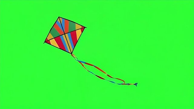 Vibrant kite with colorful tail dances across bright green screen, perfect for creative projects