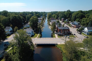 Naklejka premium Canal town, summer. Aerial view of waterway through town