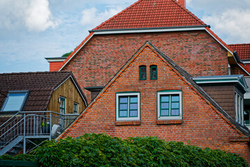 Charming red brick houses with green windows and stairs
