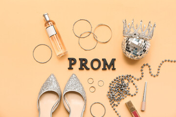 Word PROM with female shoes, disco ball and accessories on beige background