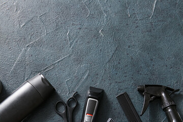 Modern trimmer and set of male shaving accessories on black grunge background