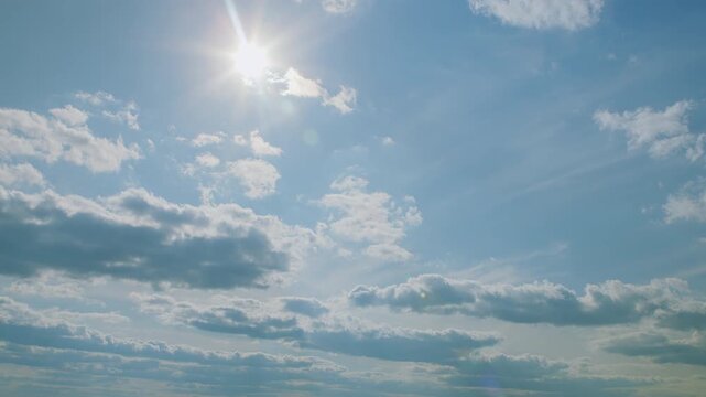 A Beautiful Bright Blue Sky Filled with Fluffy Clouds Bathed in Warm Golden Sunlight, Always